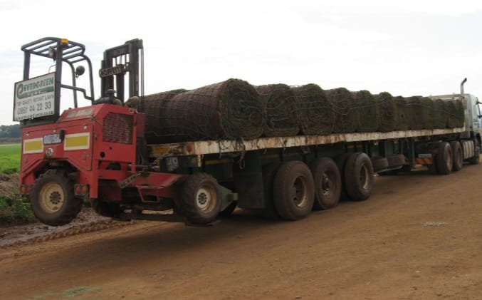 Truck loaded with rolls of instant lawn ready for delivery